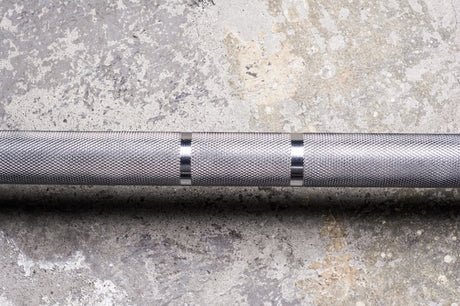 Consistent, well-crafted knurl extends to collar. These barbells feature dual lifting marks with no center knurl